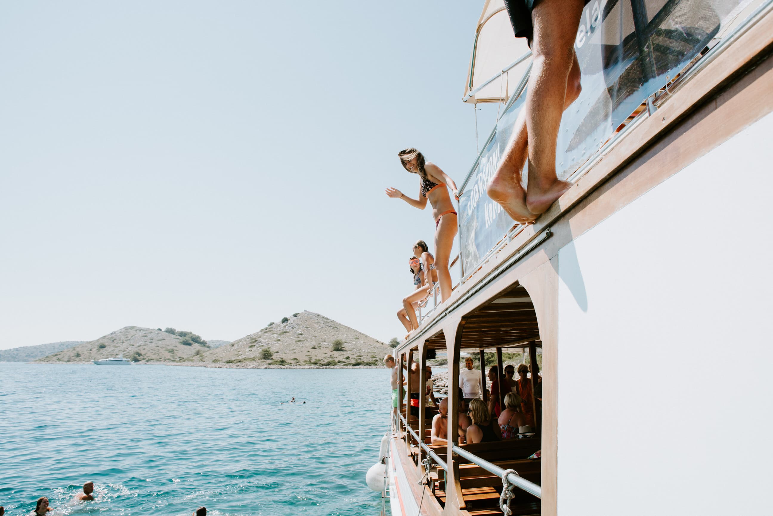Private group sunbathing on boat