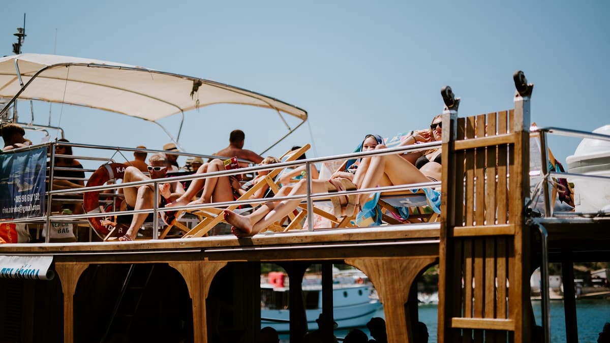 Group of friends sunbathing on the top deck